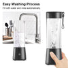 Black portable blender with water being filled and rinsed, shown next to a kitchen faucet.